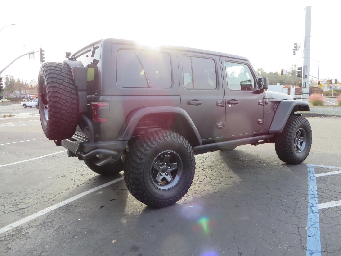 2020 BLACK /BLACK Jeep Wrangler Unlimited Rubicon (1C4HJXFGXLW) with an 3.6L V6 DOHC 24V FFV engine, 6A transmission, located at 2630 Grass Valley Highway, Auburn, CA, 95603, (530) 508-5100, 38.937893, -121.095482 - STANDARD CONTENT AEV RX Front Bumper AEV Front Skid Plate AEV Non-Winch Cover Plate AEV 7000 Series Lights AEV Light Cover Kit AEV 2.5" DualSport RT Suspension System AEV Front Geometry Correction Brackets AEV Steering Stabilizer AEV Rear Bumper AEV Swing-Out Tire Carrier AEV CHMSL Mount - Photo#4